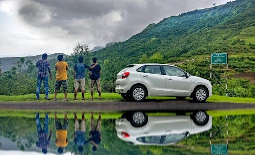 Group of Travelers Using Car Rental Services in the Hills